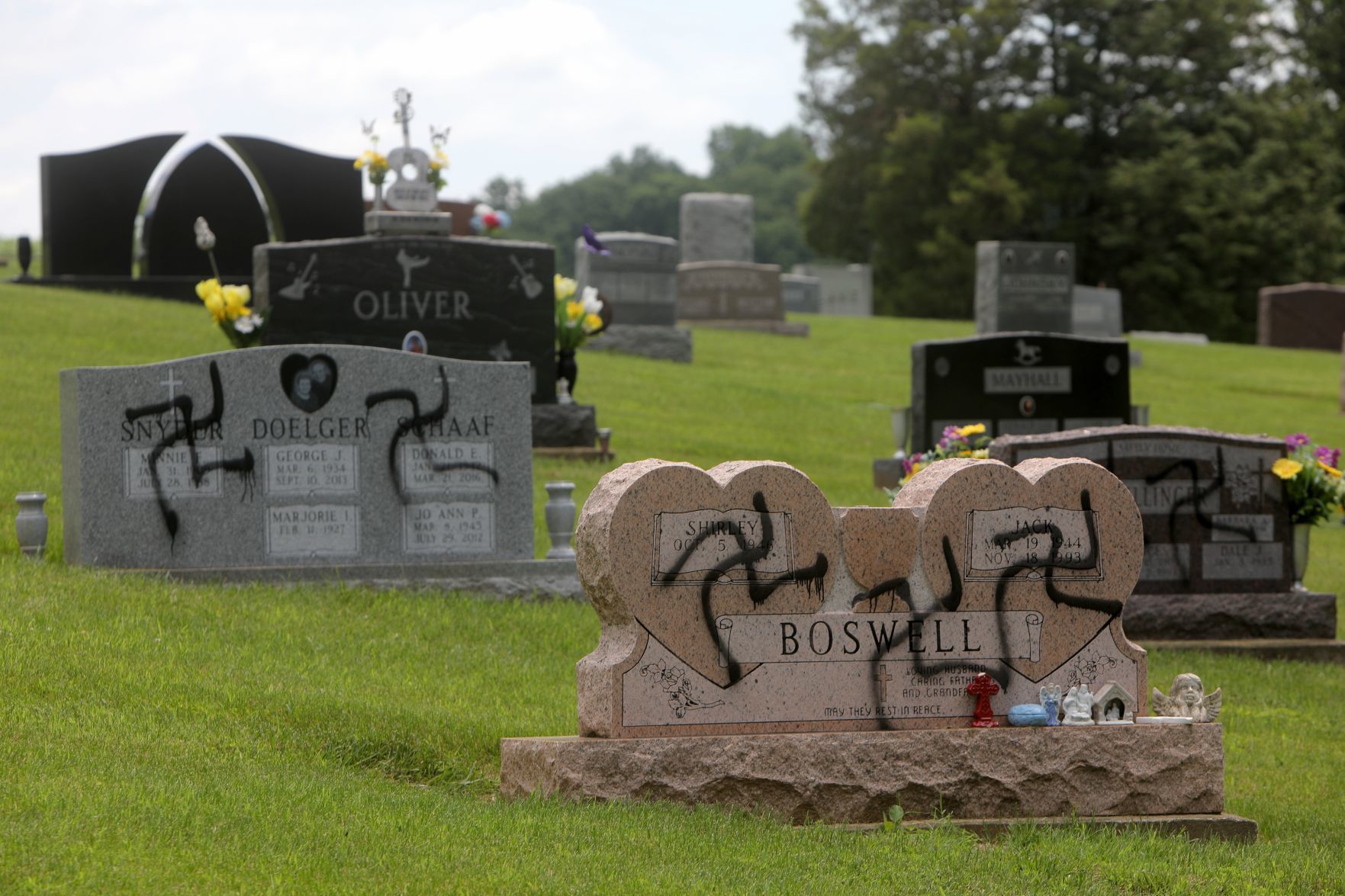 Vandal spray-paints swastikas 150 to 200 headstones and markers